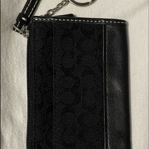 Black, Coach change purse. Never been used.
